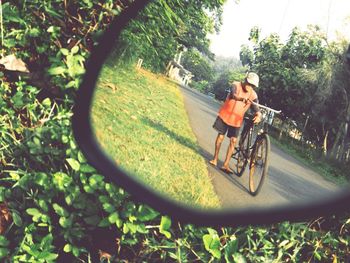 Man riding bicycle on field