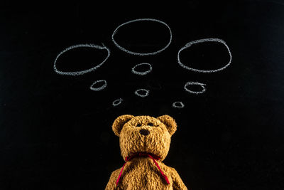 Close-up of toy against black background
