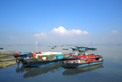Boats moored in river