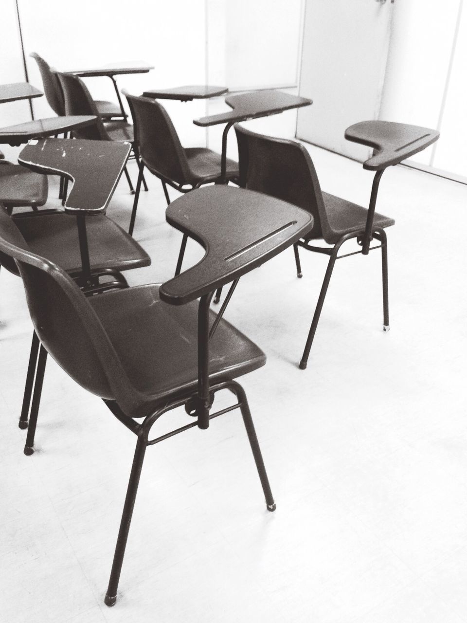 chair, empty, absence, table, indoors, furniture, seat, no people, arrangement, day, in a row, group of objects, still life, sunlight, place setting, high angle view, large group of objects, restaurant, hanging, lighting equipment