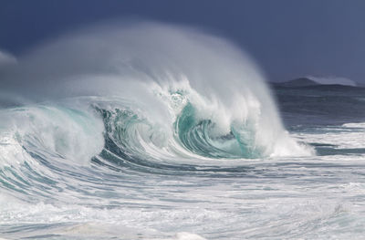 View of waves in sea against sky