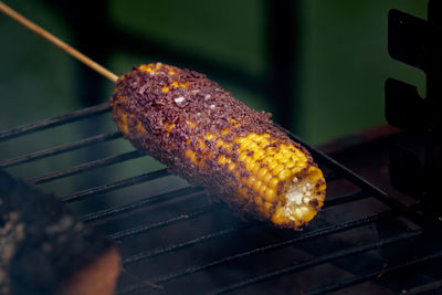 Close-up of corn on barbecue
