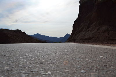 Surface level of road against mountain range