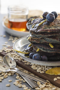 Close-up of pancakes in plate on table