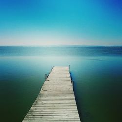 Scenic view of calm sea against clear sky