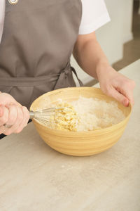 Midsection of man preparing food