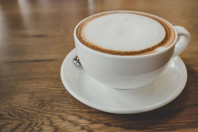 Close-up of coffee cup on table