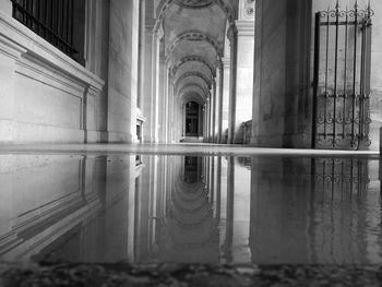 Reflection of building in puddle