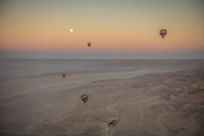 Hot air balloon flying over land