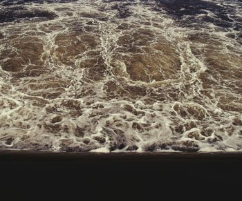 Close-up of wave on beach