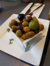 Close-up of fruits in plate on table