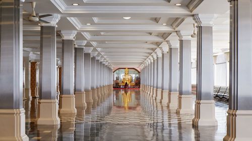 Rear view of man walking in corridor