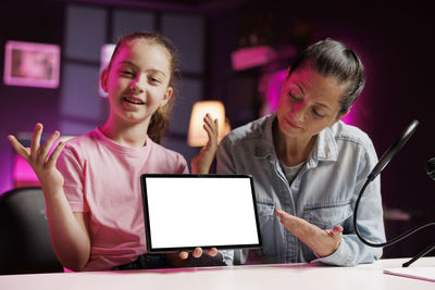 Portrait of businesswoman working on table