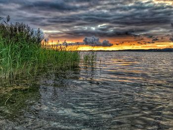 Scenic view of sea against dramatic sky