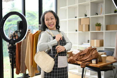 Portrait of young woman using mobile phone