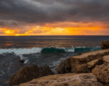 Scenic view of sea against sky during sunset