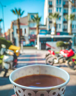 Close-up of coffee on table in city