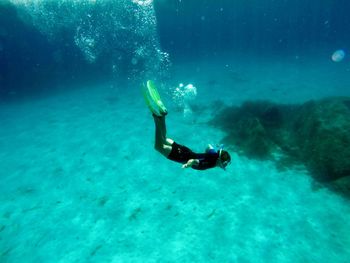 Person swimming in sea