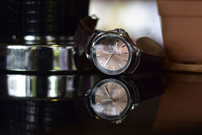 Close-up of clock on table