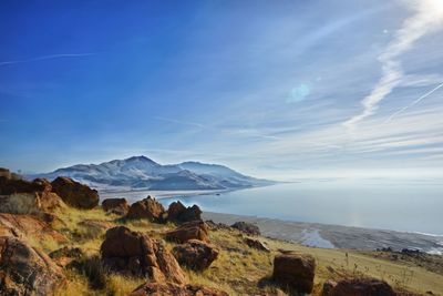 Scenic view of mountains against blue sky