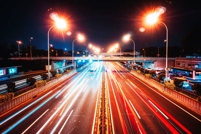 High angle view of light trails on road at night