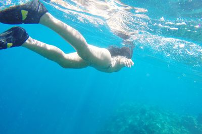 High angle view of man swimming in sea