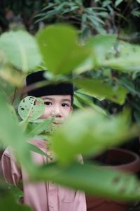 Portrait of boy in plant