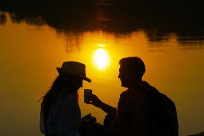 Silhouette of woman at sunset