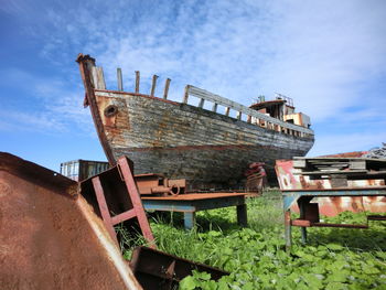 Abandoned ship against sky