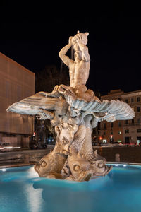 Statue of fountain at night