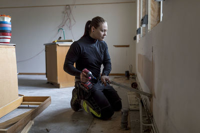 Woman renovating house