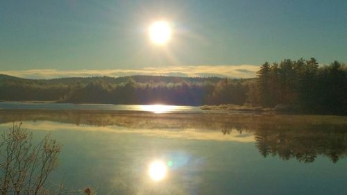 Sun shining over lake