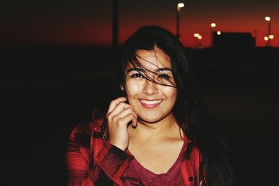 Portrait of happy beautiful woman during sunset