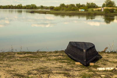 Boat moored on lakeshore