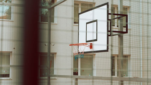 Low angle view of basketball hoop against building