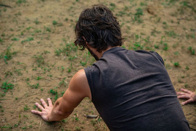 Rear view of man standing on land