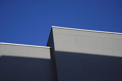 Low angle view of building against blue sky