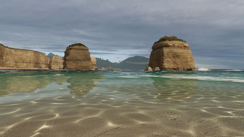 Scenic view of beach against sky