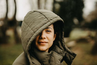 Woman with hooded jacket portrait