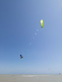 People paragliding in sky