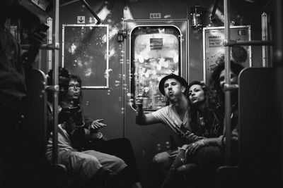 People sitting in train at night