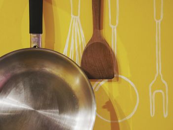 Close-up of tea cups on wall at home