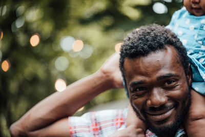 Close-up portrait of a smiling young man