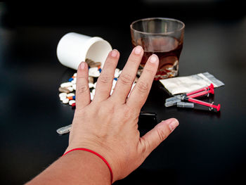 Close-up of hand holding drink