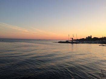 Scenic view of sea against clear sky during sunset