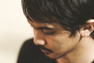 High angle close-up of young man at home