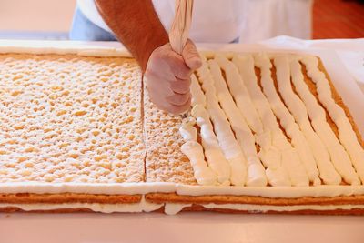 Midsection of person preparing food