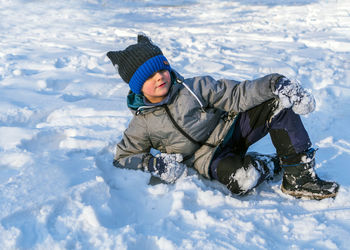 Rear view of boy in snow