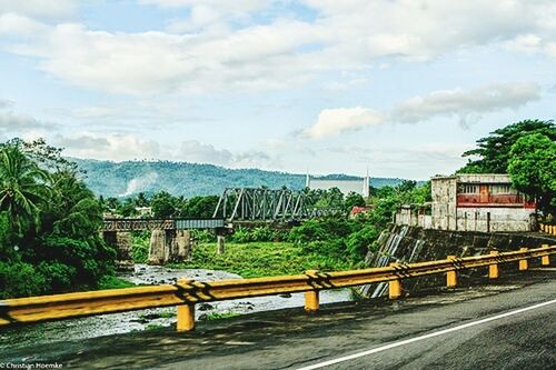 SCENIC VIEW OF BRIDGE OVER LANDSCAPE AGAINST SKY