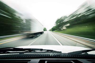 Blurred motion of car moving on road